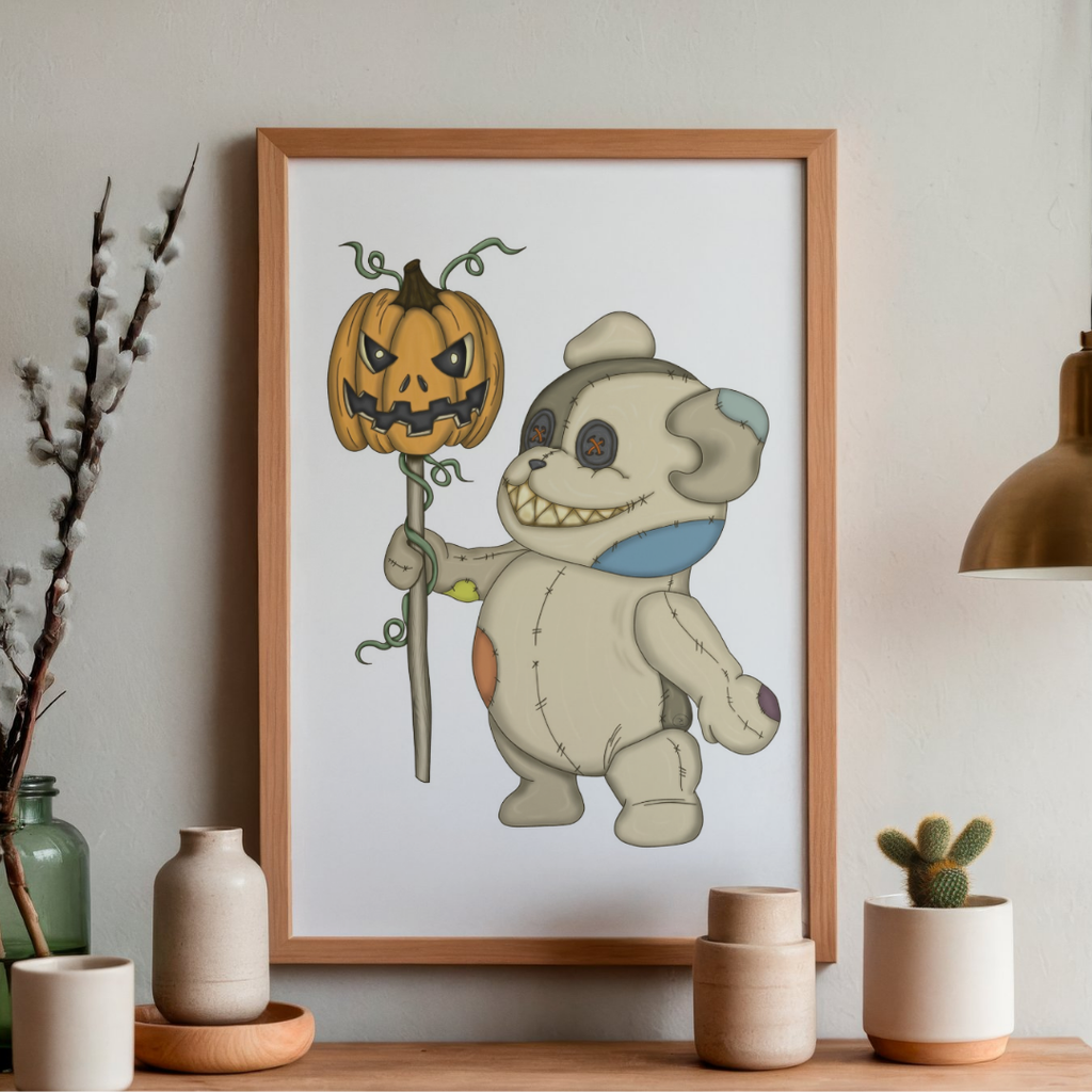 Framed illustration of a bear holding a jack-o'-lantern on a wall above a wooden shelf with decorative items.