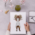 Person holding a print of a creature with faun features on a table with flowers and a glass of green liquid.