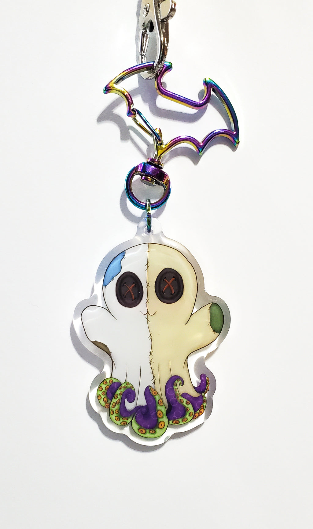 Keychain with a ghost and octopus design on a white background