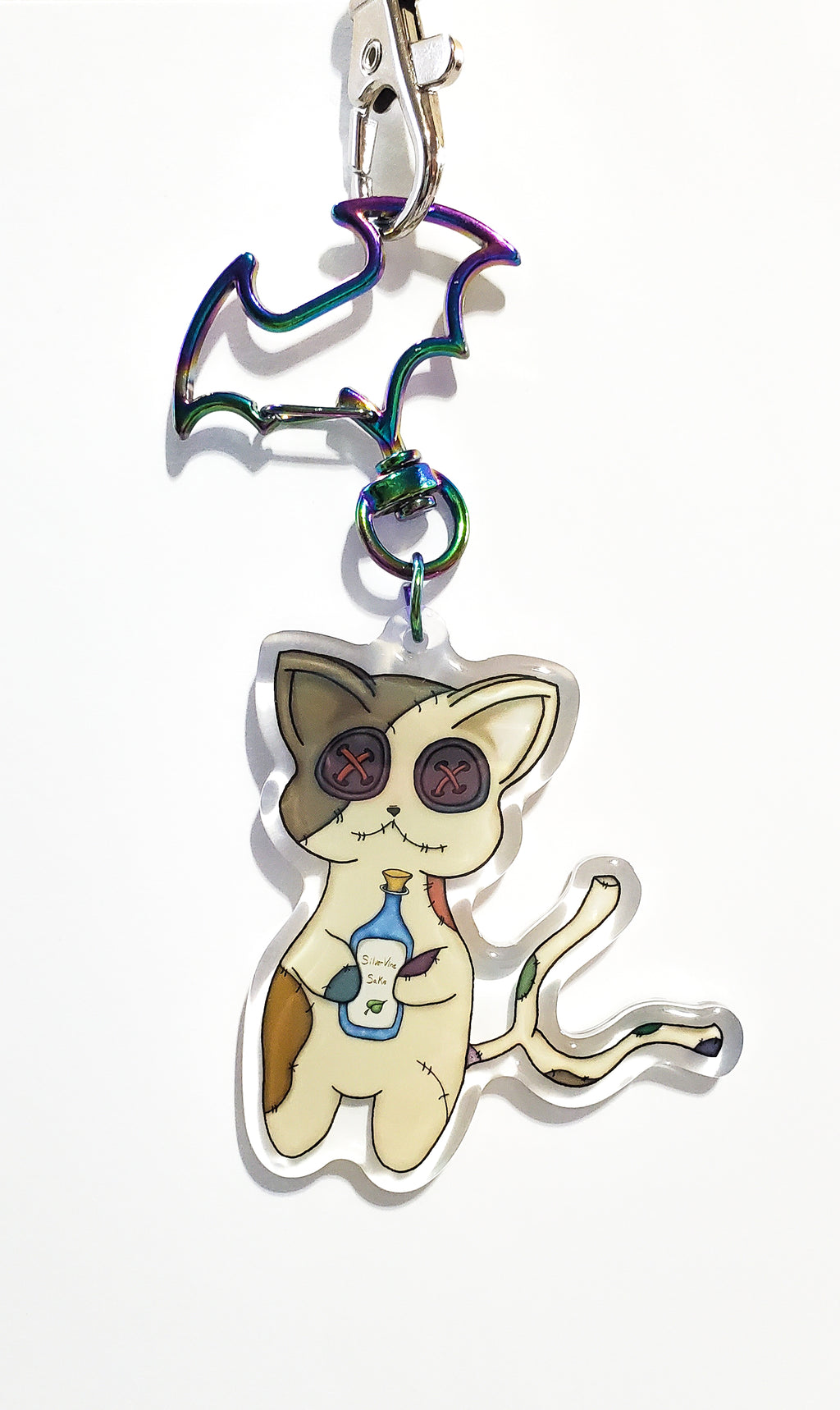 Cat-shaped keychain with colorful design on a white background