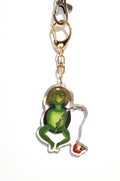 Kappa character keychain with gold chain on a white background
