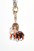 Keychain with a spider woman character on a white background