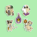 Set of Halloween-themed stickers featuring cartoon animals on a green background